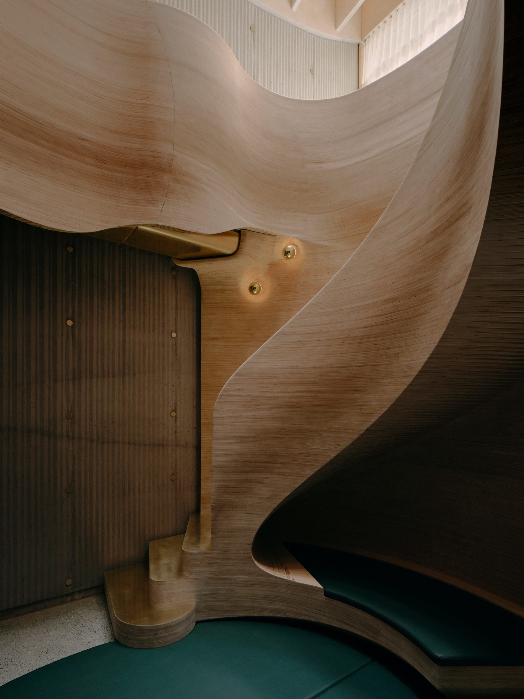 Curving plywood staircase at Northcote House