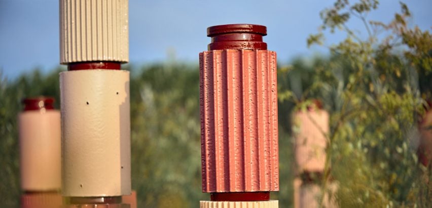 Terracotta pillars in a vineyard