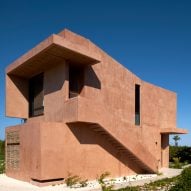 Reyes Ríos + Larraín Arquitectos extends pink beach house along narrow Yucatán property