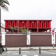 K+M Arquitectura y Urbanismo slots red pergola behind historic building in Peru