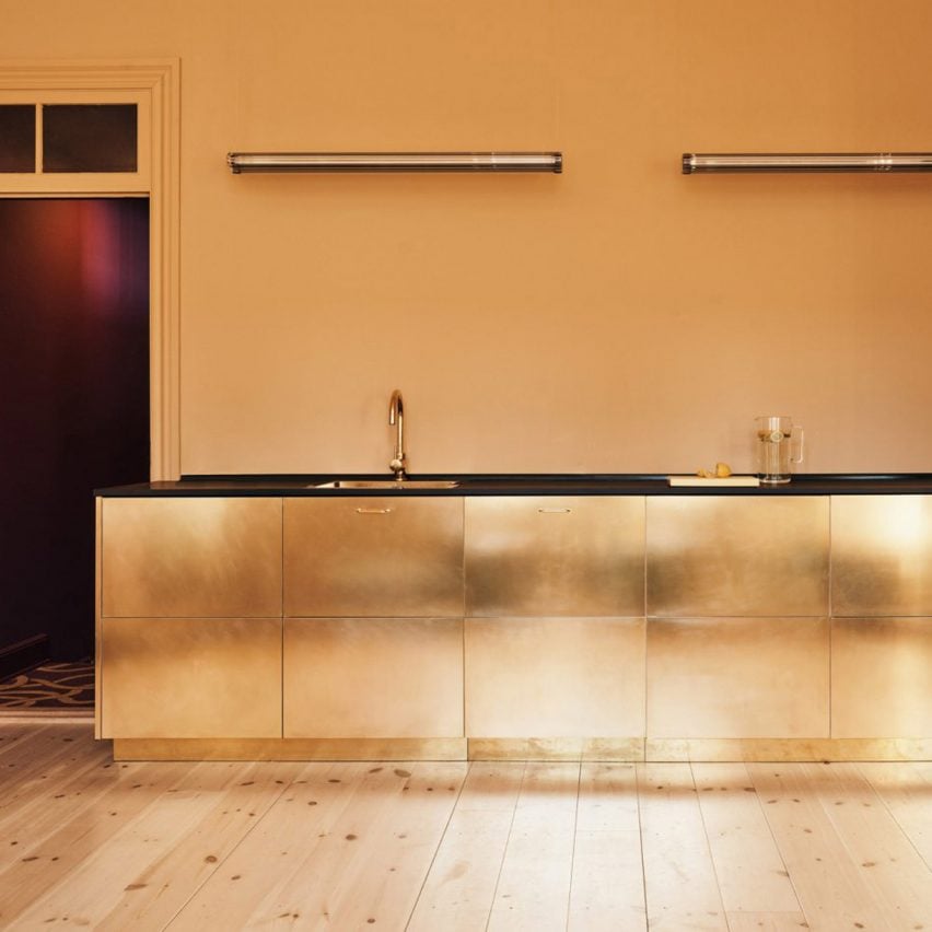 Kitchen with metallic gold units