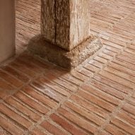 Thin red brick floor downstairs of Strandgade warehouse