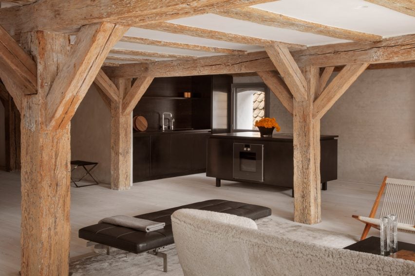 Structural pine beams and blackened steel kitchenette