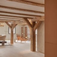 Structural wooden beams and furniture in open plan space