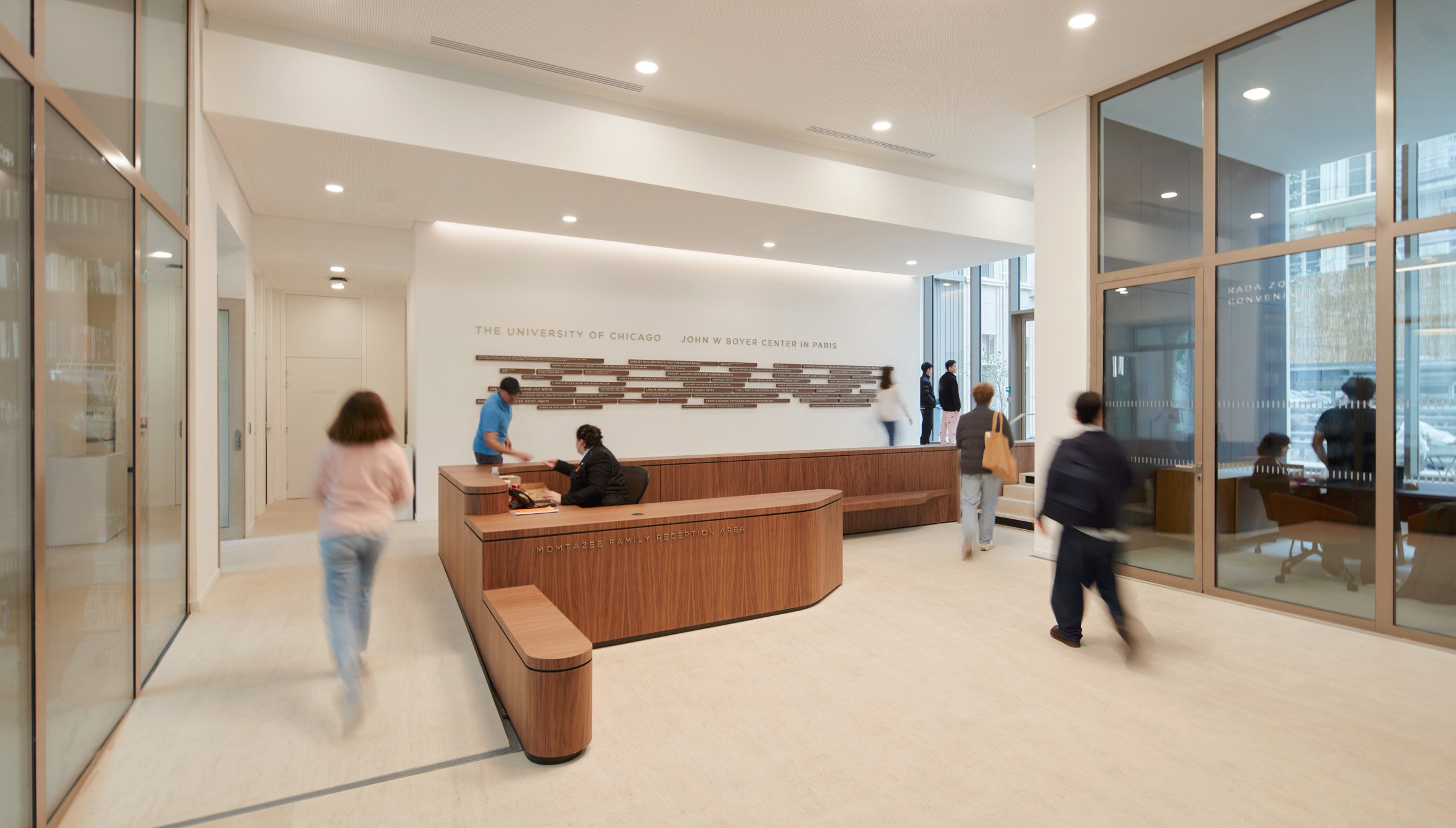 White lobby with brown reception desk