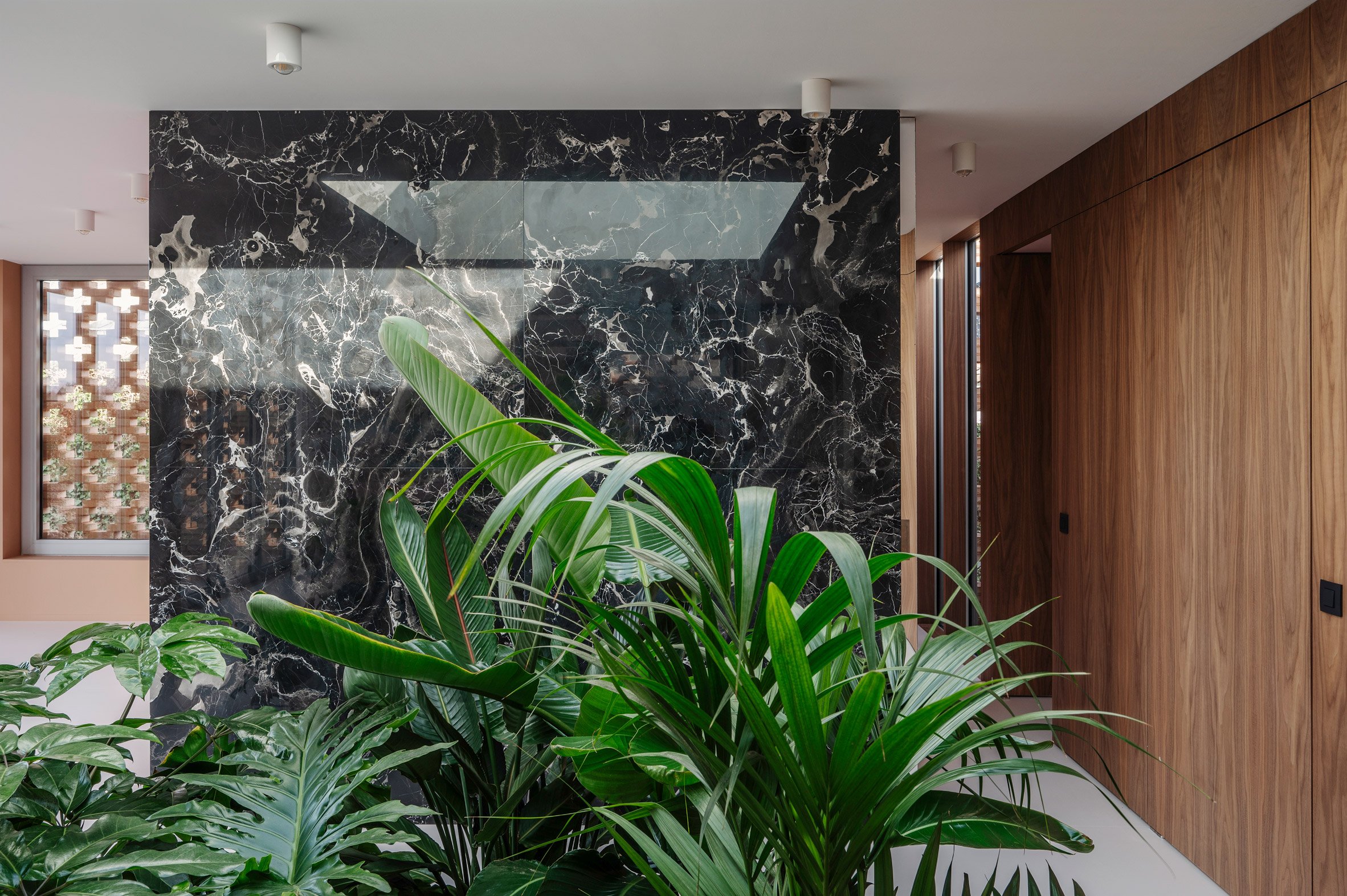 Marble wall within Patio House in Belgium