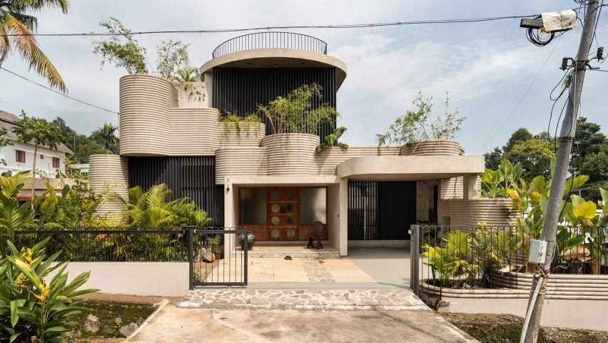 Curved house with plants India