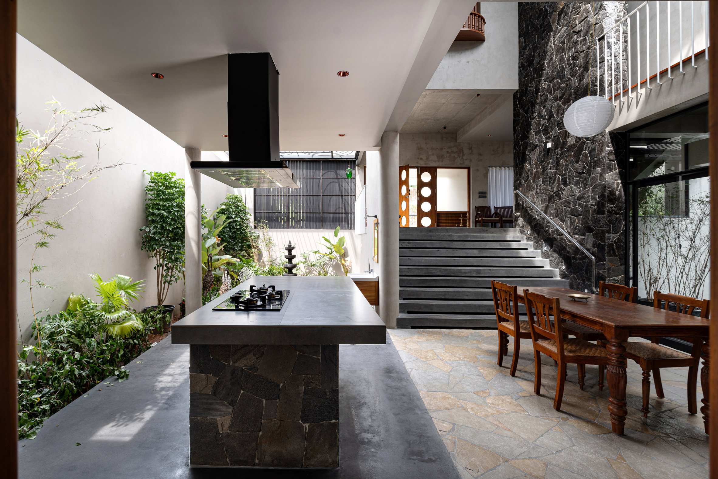 Kitchen space within home by Tropical Architecture