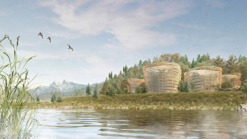 A visualisation of four wooden circular building structures in tones of brown, on a waterfront, surrounded by greenery and a blue sky above.