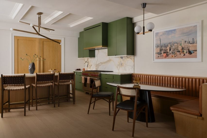 Kitchen and dining area with a chestnut island and olive green cabinetry