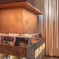 Records illuminated inside wooden shelving unit