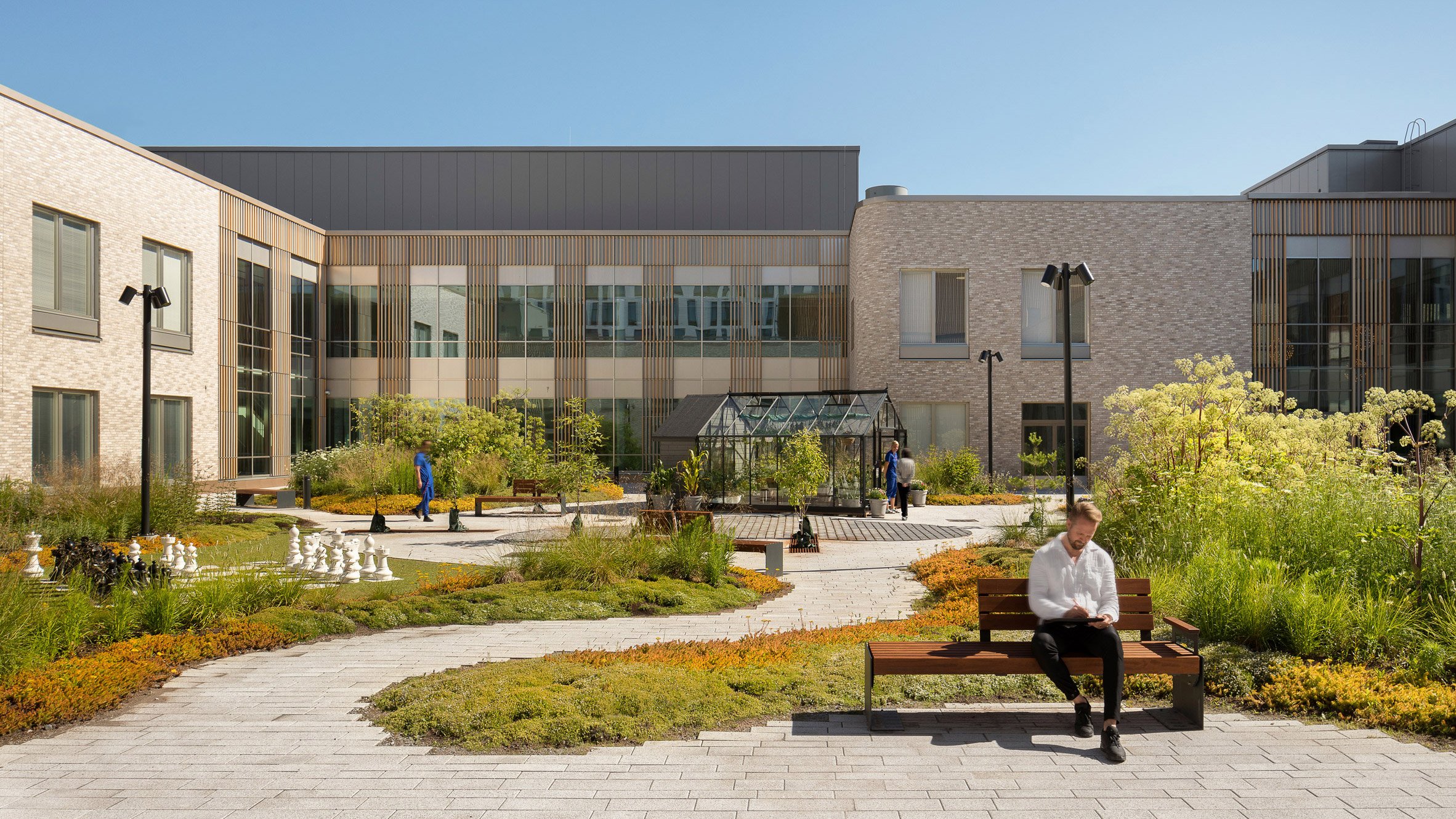 https://static.dezeen.com/uploads/2024/12/cf-moller-architects-tampere-psychiatric-clinic-finland_dezeen_2364_hero.jpg