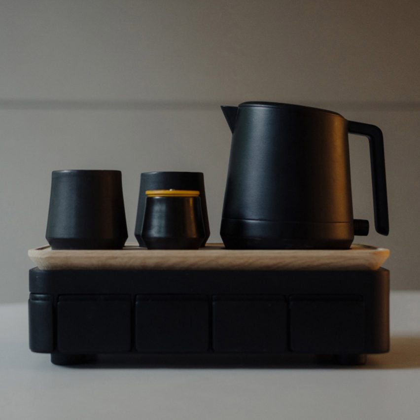 an image of a black teapot and cups