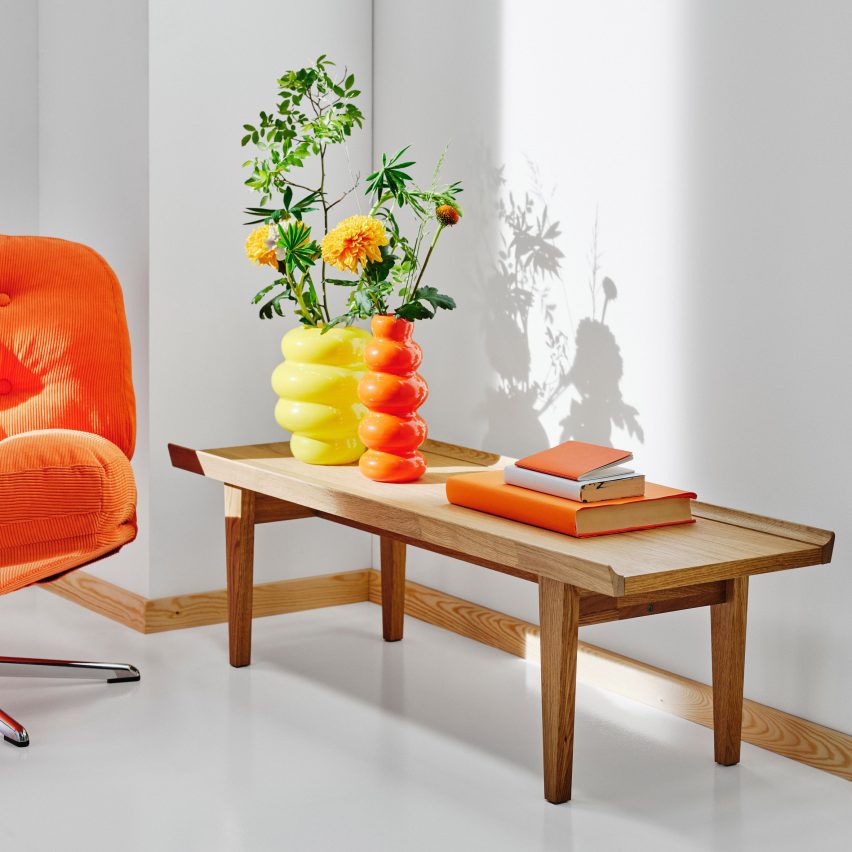 Photo of the Guttane/Novette side and coffee table in oak wood with brightly coloured homewares on top