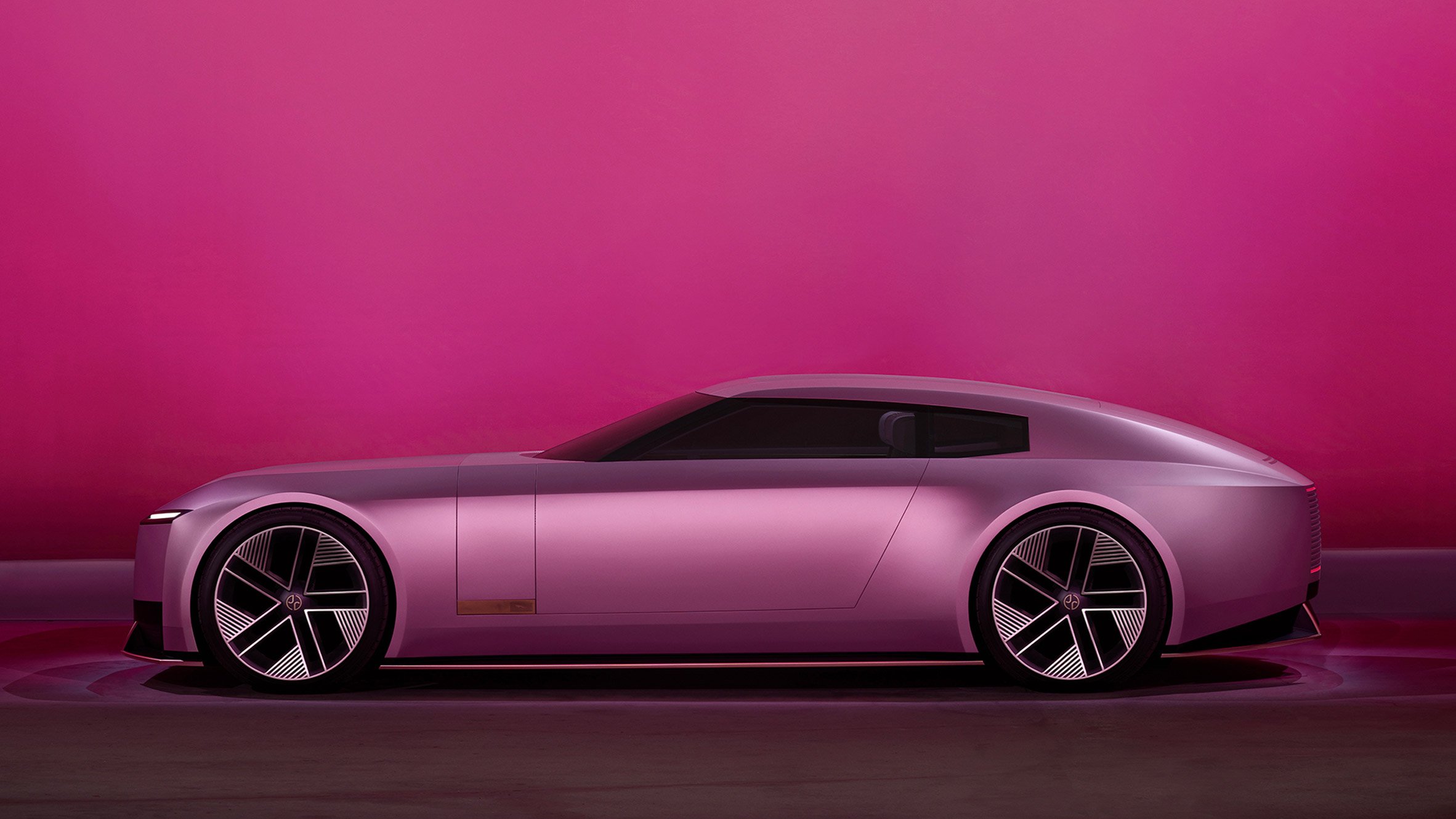 Pink Type 00 concept car by Jaguar on a pink backdrop