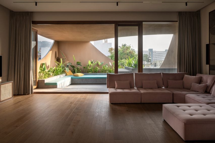 View towards terrace within concrete home by Cadence Architects