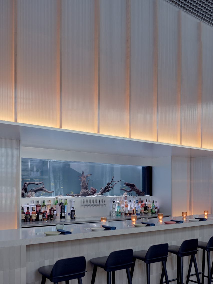 Bar counter with glowing polycarbonate panels overhead