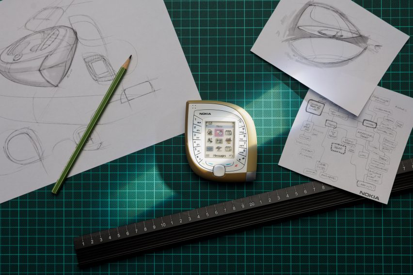 Photo of the "Mango phone" (Nokia 7600) surrounded by designer Tej Chauhan's sketches