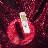 Photo of the Nokia 7373 against a sparkly red curtain background