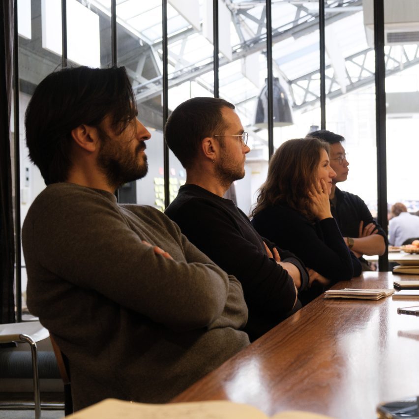 people sat at a meeting table