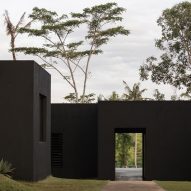 Senyum Design places matte-black Jahten House overlooking jungle in Bali