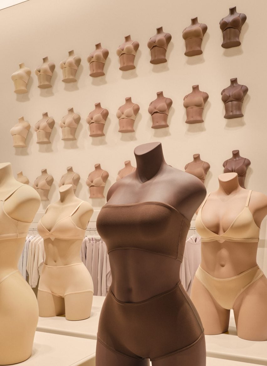 Tonal shapewear and underwear displayed on matching mannequins