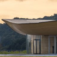 Kengo Kuma tops sculptural community centre with swooping bamboo roof