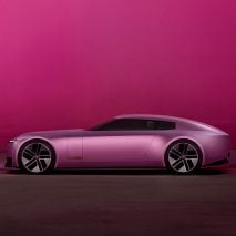 Pink Type 00 concept car by Jaguar on a pink backdrop