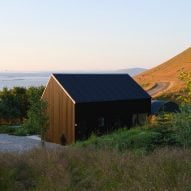 Studio Bua creates "elemental look" for black cabin overlooking Icelandic fjord