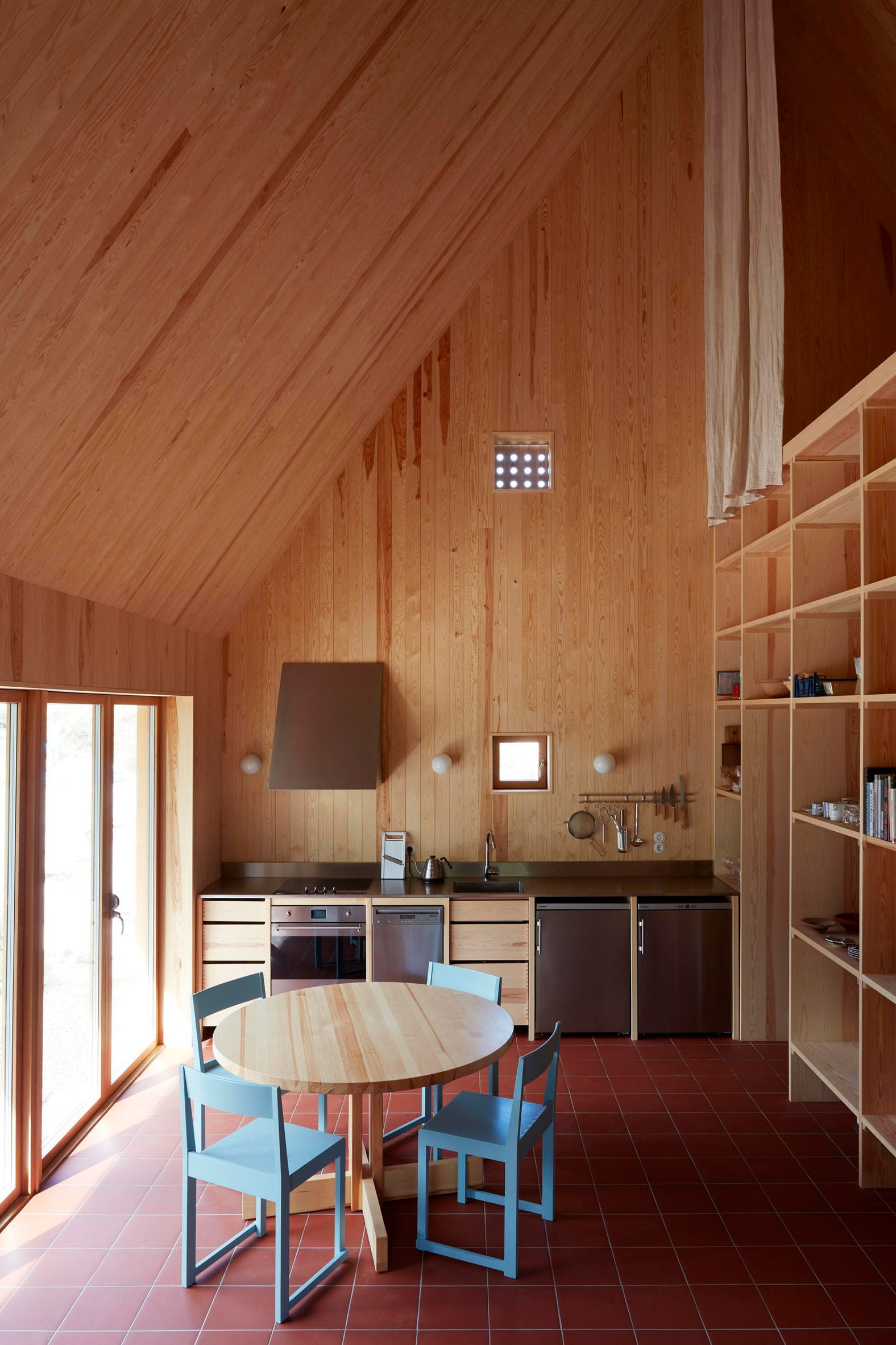 Red-tile kitchen in Swedish home