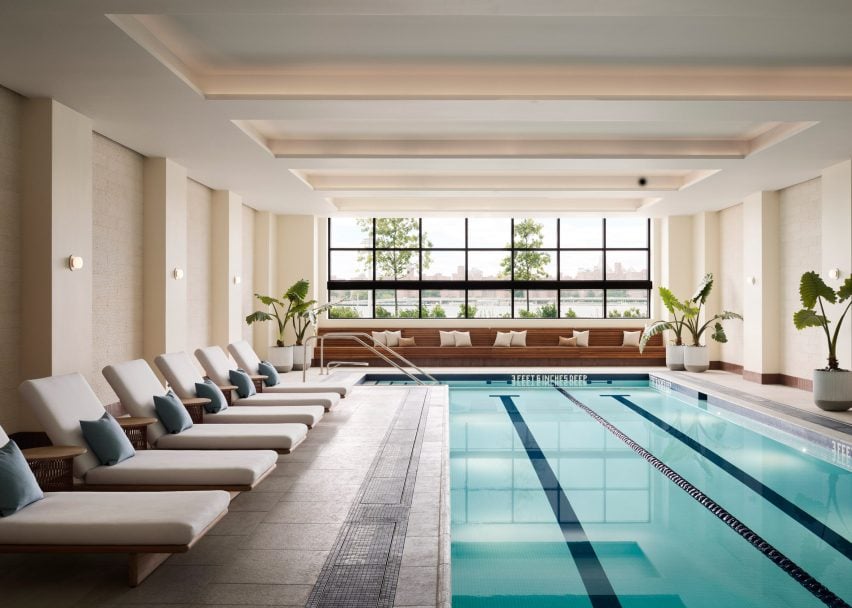 An indoor swimming pool with a view of the East River