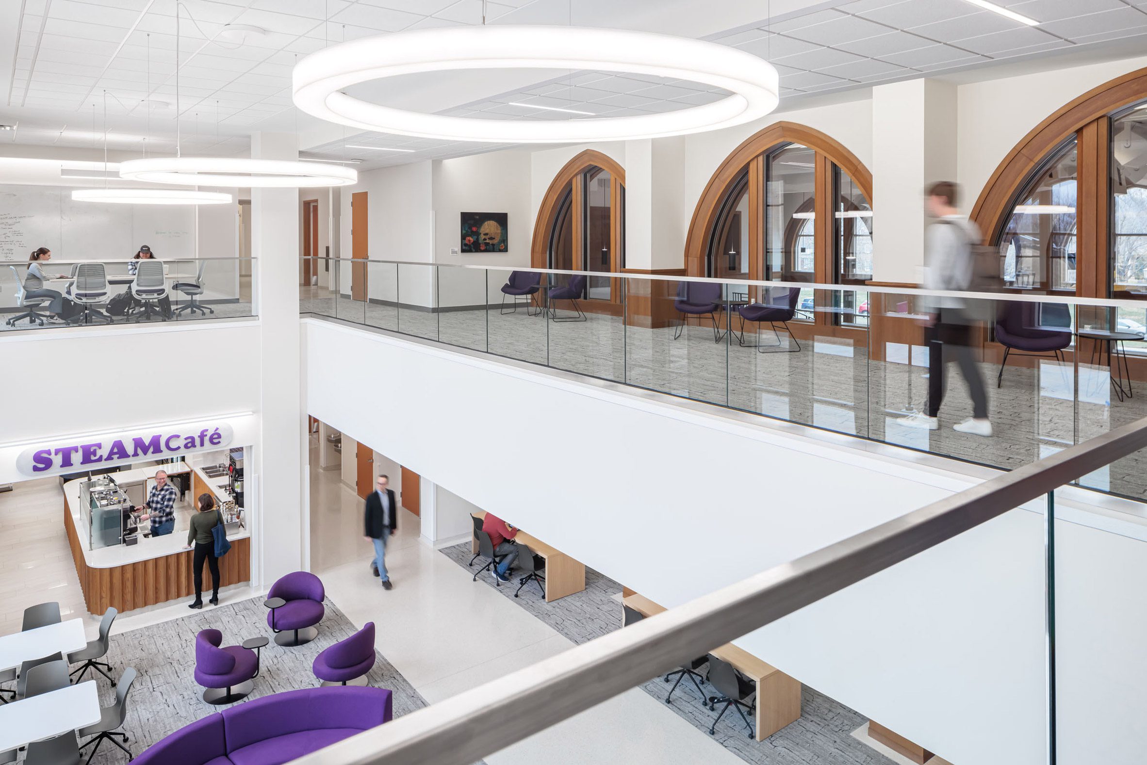 Bright white interior with purple furniture and signage