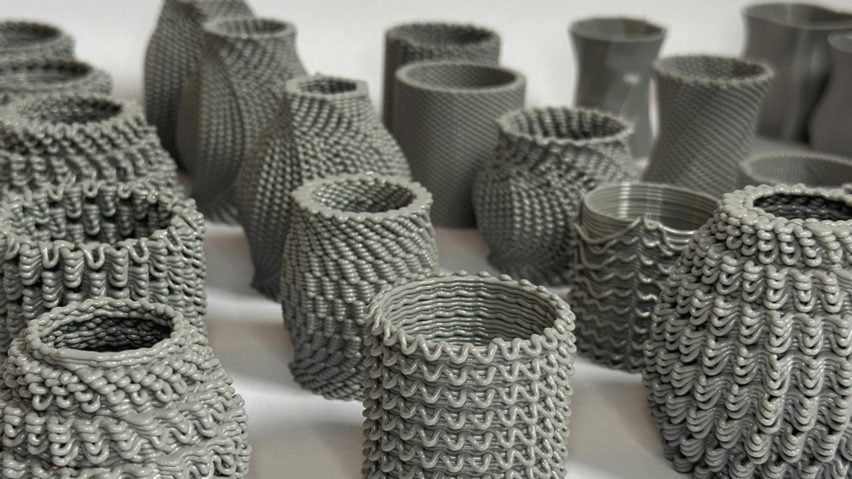 A photograph of multiple textured vases in tones of grey.