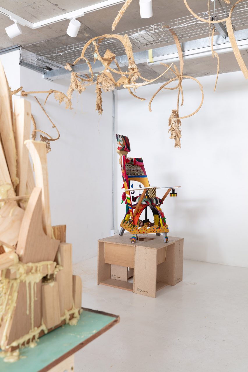 Photo of a multicoloured chair made from bits of different offcuts in a gallery