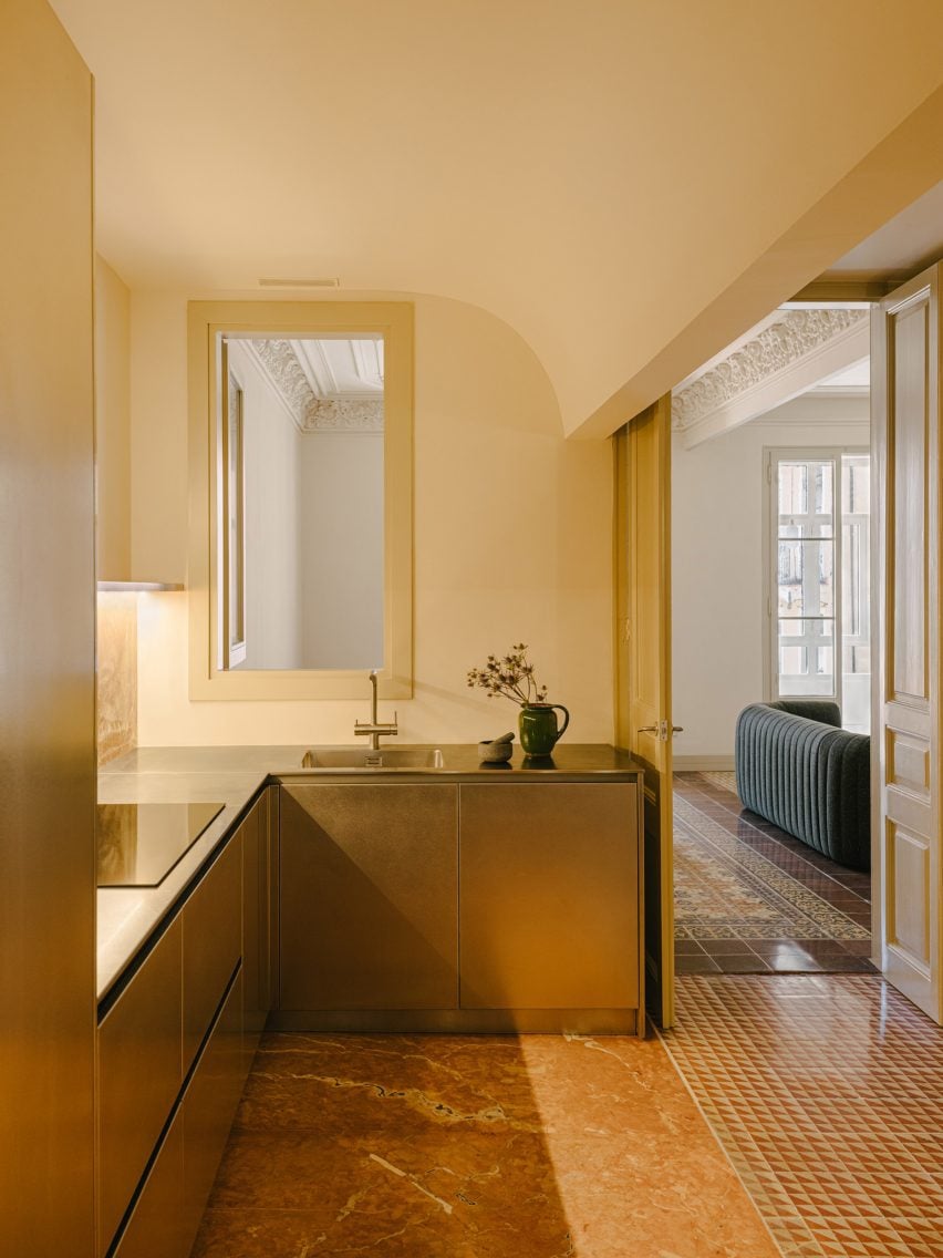 Steel kitchen cabinets and red marble floor