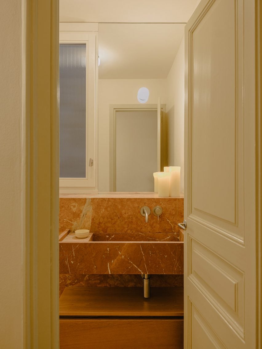 Red marble sink in apartment