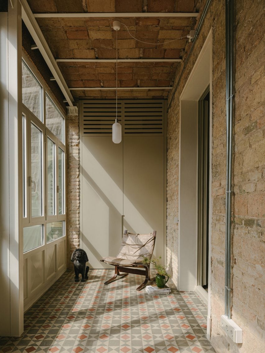 Internal patio with exposed brick and mosaic tile floors