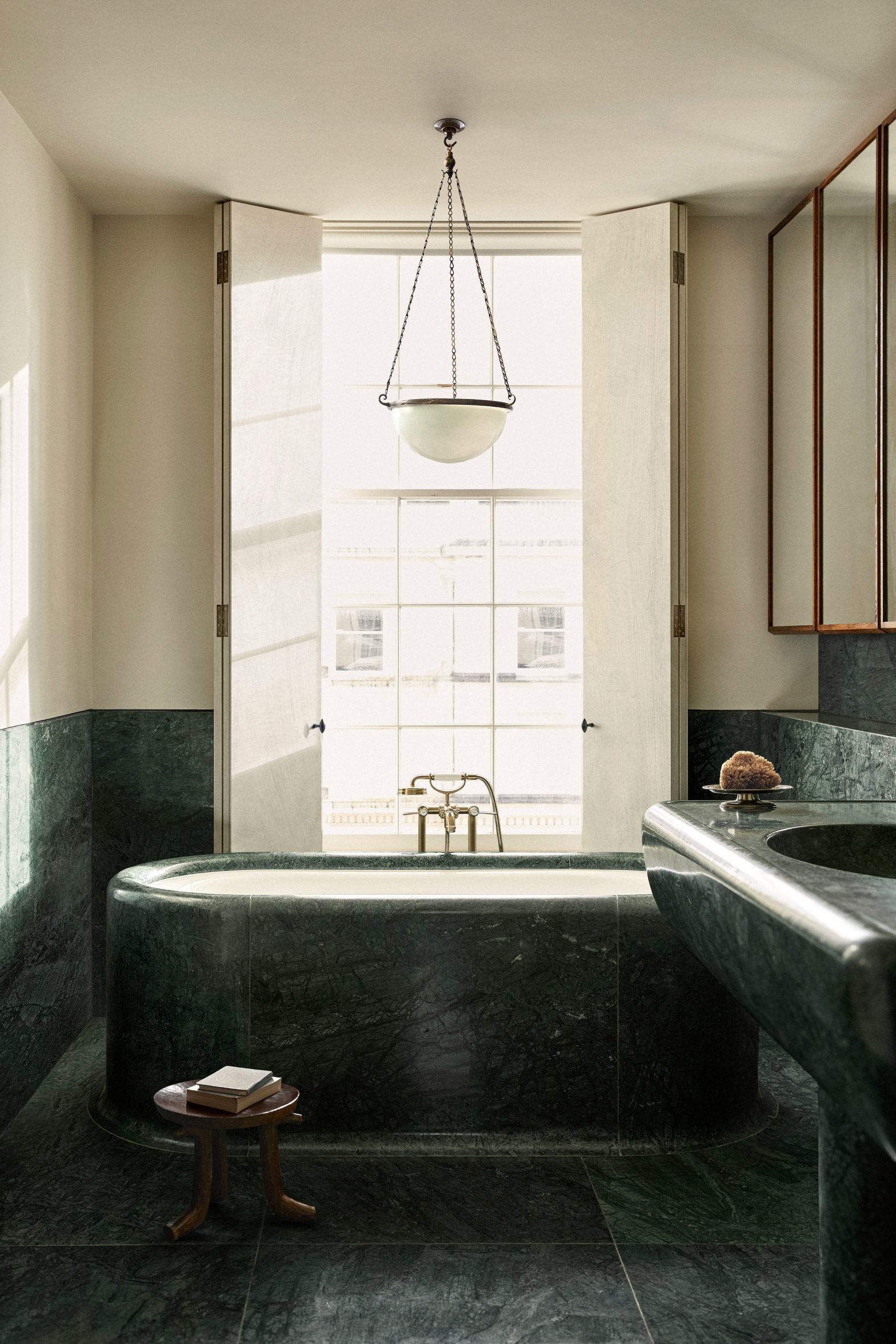 Green marble was carved into a bathtub and sink