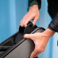 Person pulling lever to attach CLIP clamps to bike wheel