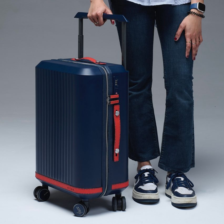 a photograph of a person holding a suitcase