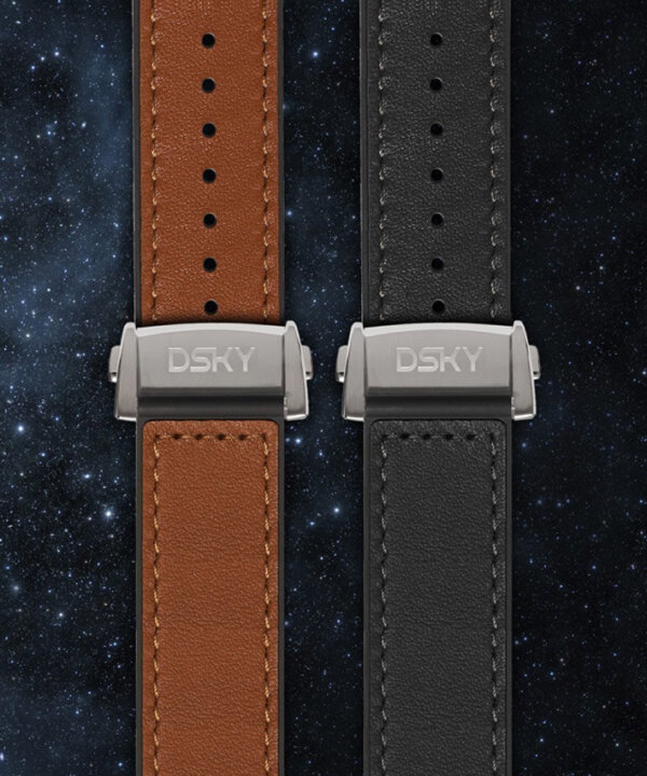 Studio photo of two watch straps, one tan one black, each with a fine DSKY logo engraved on the clasp