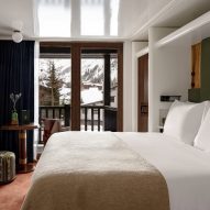 Bedroom with mountains beyond