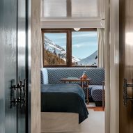 Gloss doors lead through to bedroom area