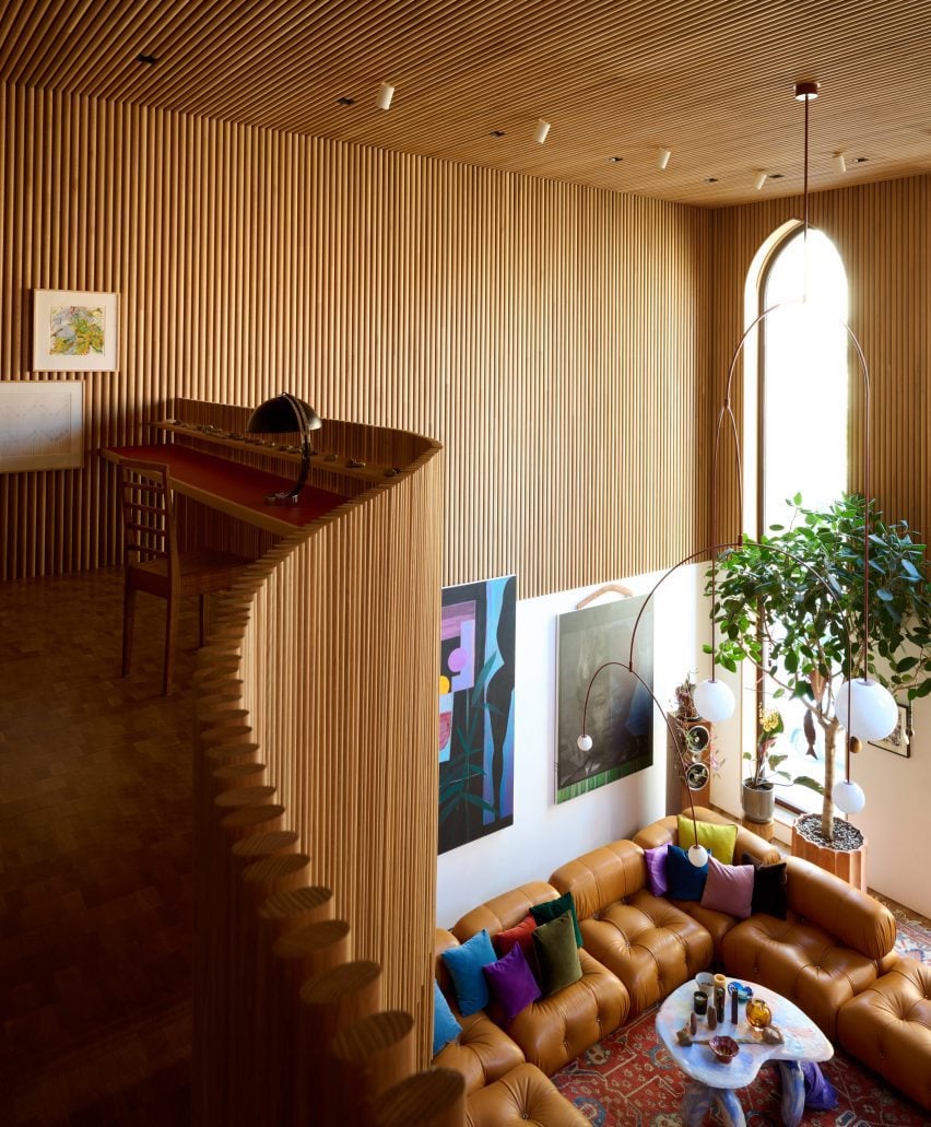 A mezzanine library overlooking a living space