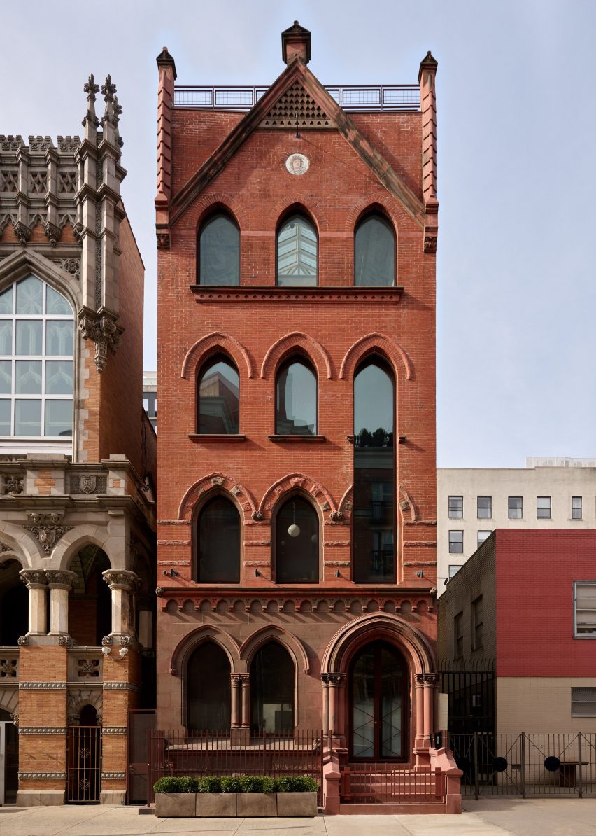 Exterior view of red brick and brownstone rectory building in Harlem