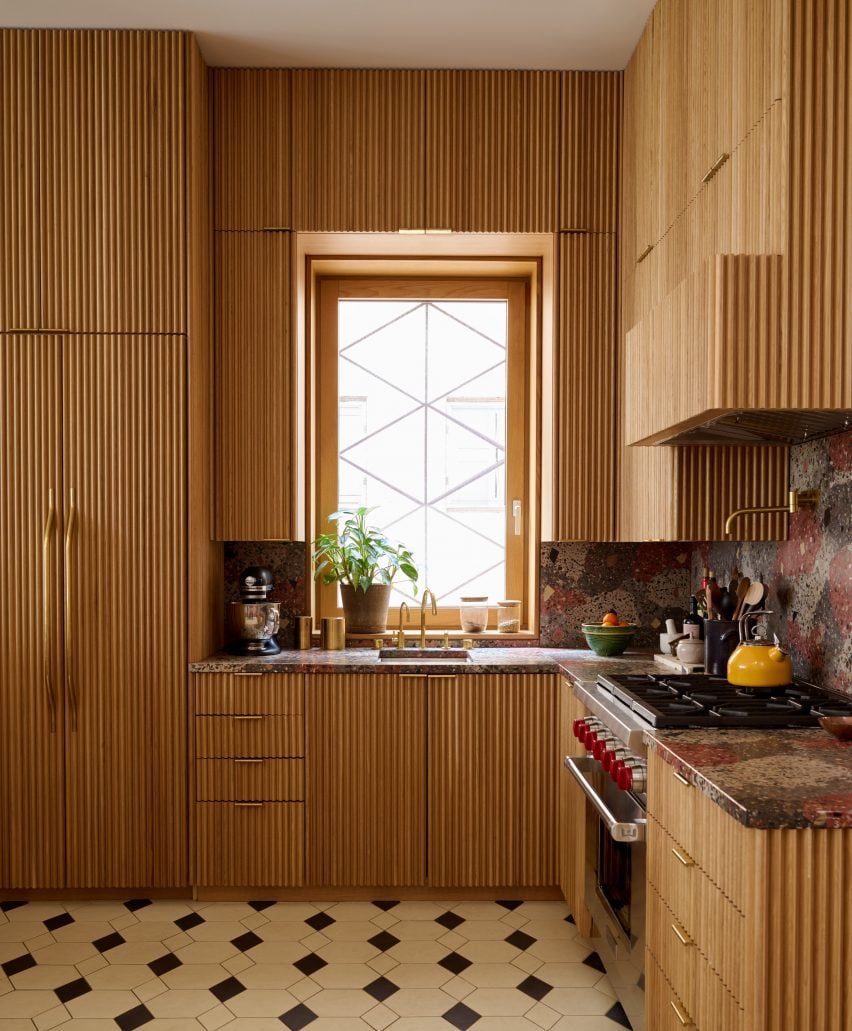 Kitchen with floor-to-ceiling reeded oak cabinetry