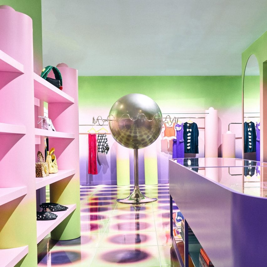 Pink and green interior of Uchronia store with silver planet