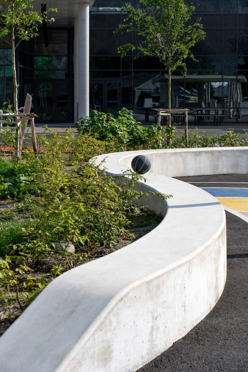 A concrete bench helps to demarcate different zones.