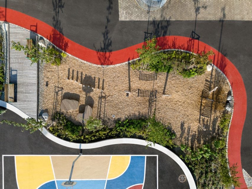 Red pathway and different zones of playground viewed from above