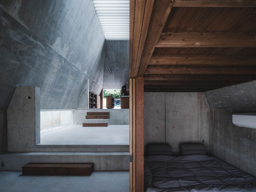 Bedroom interior within concrete home by IGArchitects